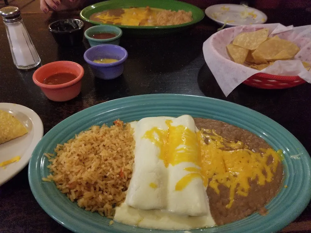 Chicken Enchiladas with Rice and Beans